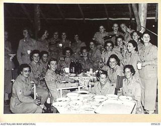 LAE AREA, NEW GUINEA. 1945-08-31. A HAPPY CROWD OF AUSTRALIAN ARMY MEDICAL WOMEN'S SERVICE OF 2/7 GENERAL HOSPITAL ENJOYING A FEW DRINKS AFTER A BUFFET TEA HELD IN THE AUSTRALIAN ARMY MEDICAL ..