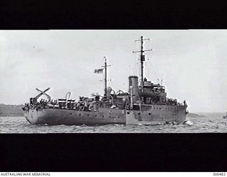 SYDNEY, NSW. STARBOARD QUARTER VIEW OF THE CORVETTE HMAS BUNDABERG (J231). NOTE THE 20 MM OERLIKON AA GUNS IN THE BRIDGE WING AND AFT. MINESWEEPING KITES ARE CARRIED ON THE QUARTERDECK WITH DEPTH ..