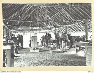 LABU POINT, LAE, NEW GUINEA. 1944-03-24. THE MACHINE SHOP AT THE 1ST WATERCRAFT WORKSHOP USED FOR FITTING AND TURNING AND THE MAKING OF UNOBTAINABLE PARTS FOR SMALL CRAFT