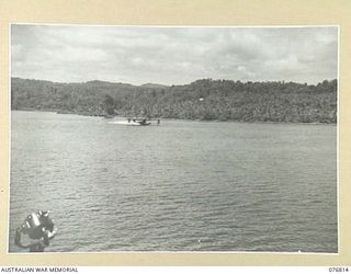 JACQUINOT BAY, NEW BRITAIN. 1944-11-04. A RAAF CATALINA FLYING BOAT LANDING ON THE WATERS OF THE BAY