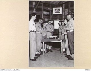 PORT MORESBY, NEW GUINEA. 1944-05-23. MEMBERS OF THE TOC H SOCIETY REMEMBERING THEIR FALLEN BRETHREN DURING THE "CEREMONY OF LIGHT" AT ST JOHN'S CHURCH. IDENTIFIED PERSONNEL ARE:- S6585 S/A (STORES ..