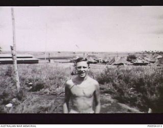 NADZAB, MARKHAM VALLEY, NEW GUINEA. 1944-03. UNIT NO 1 WIRELESS UNIT RAAF. JAPANESE KANA WIRELESS INTERCEPT OPERATOR LEADING AIRCRAFTMAN A. JACK BROWN. BUILDING IN MIDDLE FRONT LEFT IS THE ..