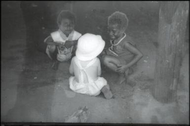 Three children making friends : Mapamoiwa Station, D'Entrecasteaux Islands, Papua New Guinea, 1956-1959 / Terence and Margaret Spencer