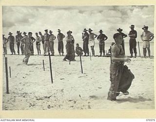 KELANOA, NEW GUINEA, 1944-02-20. NX102253 PRIVATE G. SMART (1), WINNING THE SECOND HEAT OF THE SACK RACE AT THE 5TH DIVISION BEACH CARNIVAL ORGANISED BY THE AUSTRALIAN ARMY AMENITIES SERVICE