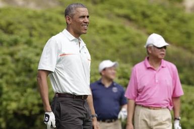 Barack Obama plays golf with Prime Minister Najib Razak, Joe Paulsen, and Mike Brush in Kaneohe Bay, Hawaii, December 24, 2014