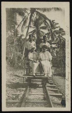Mrs. Goward going for joy ride on a light rail dolly, Ocean Island, Kiribati, 1900-1917