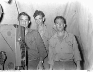 MOTUPINA POINT, BOUGAINVILLE ISLAND. 1945-01-18. PERSONNEL OF THE AMENITIES STAFF OF THE 29TH INFANTRY BRIGADE WHO ORGANISED AND PROVIDED THE FIRST OPEN - AIR PICTURE SHOW IN THE BRIGADE AREA. ..