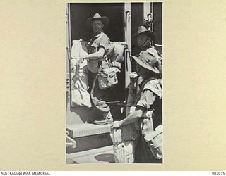 CAIRNS, QLD. 1944-10-30. TROOPS OF HEADQUARTERS COMPANY, 2/4TH INFANTRY BATTALION, ABOARD THE TROOPSHIP USS MEXICO GOING BELOW TO THEIR LIVING QUARTERS DURING THE MOVEMENT TO NEW GUINEA OF ELEMENTS ..