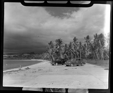 Two taxis parked on Saweni Beach, Fiji