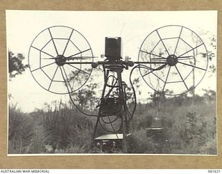 PORT MORESBY, NEW GUINEA. 1943-12-16. REAR VIEW OF THE (SEARCHLIGHT CONTROL) SITE TESTING EQUIPMENT AT THE HEAVY ANTI-AIRCRAFT GUN SITE H.8, ROYAL AUSTRALIAN ARTILLERY. PHOTOGRAPH SHOWS FROM LEFT ..