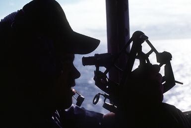 A crewman takes a sighting by sextant aboard the amphibious assault ship USS SAIPAN (LHA-2) during exercise Ocean Venture '81