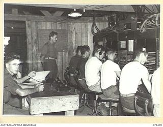 TOROKINA, BOUGAINVILLE ISLAND. 1945-01-18. A SECTION OF THE INTERIOR OF THE PACIFIC EXCHANGE "B" CORPS OF SIGNALS, SHOWING PORTION OF THE 6 POSITION 600 LINES SWITCHBOARD. AVERAGE DAILY CALLS ..