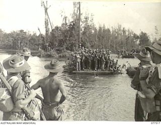 BOUGAINVILLE ISLAND. 1944-12-06. TROOPS OF THE 15TH INFANTRY BATTALION ABOARD A FERRY DRIVEN BY TWO JEEPS, WHICH CROSSES THE TARGESSI RIVER DURING THEIR ADVANCE TO TAKE OVER THE POSITIONS OCCUPIED ..