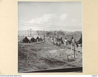 CAPE WOM, WEWAK AREA, NEW GUINEA. 1945-08-30. THE WORKSHOP AREA AND TENT LINES OF 2/4 ARMOURED REGIMENT WORKSHOP, CORPS OF AUSTRALIAN ELECTRICAL AND MECHANICAL ENGINEERS