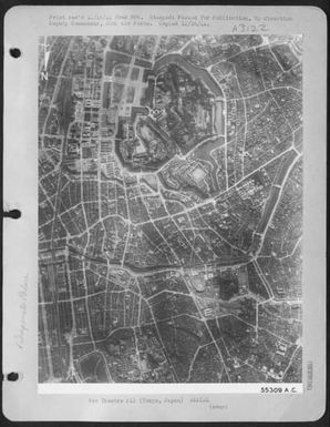 In the heart of the congested city of Tokyo lies the moated palace grounds of Japan's emperor as photographed for the first time by Saipan-based Superofrts. Just below the palace which fills the left center of the photograph is a large railroad (U.S. Air Force Number 55309AC)