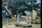 [Group with outrigger canoe]