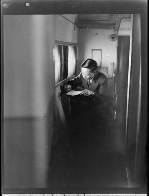 Unidentified man inside Tasman Empire Airways flying boat, RMA New Zealand ZK-AME flight to Fiji