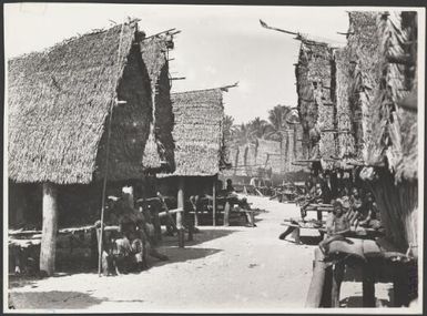 A village scene on Mailu Island, Papua New Guinea, June 1921 / Frank Hurley