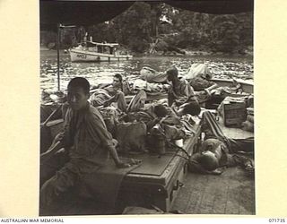 WASU, PAPUA, 1944-03-25. ELEVEN JAPANESE PRISONERS OF WAR BEING TRANSPORTED FROM WASU ASND SINGORKAI TO KILIGIA BY AN AUSTRALIAN ARMY WATER TRANSPORT BOAT. ALTHOUGH THEY APPEAR IN AN ADVANCED STATE ..