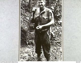 SHAGGY RIDGE, NEW GUINEA. 1943-12-27. QX32981 PRIVATE H. E. RAISKIO ONE OF THE EARLY WOUNDED OF THE 2/16TH AUSTRALIAN INFANTRY BATTALION, 21ST AUSTRALIAN INFANTRY BRIGADE DURING THE ATTACK ON THE ..