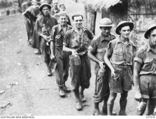 PAPUA, NEW GUINEA. 1942-10. MEMBERS OF THE 2/27TH AUSTRALIAN INFANTRY BATTALION AS THEY REACHED THE OUTPOST AT ITIKI, AFTER BEING OUT OF TOUCH WITH OTHER TROOPS FOR 13 DAYS. THEY HAD HAD VERY ..