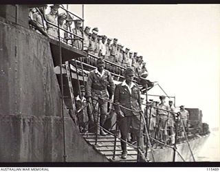 TOROKINA, BOUGAINVILLE. 1945-09-08. LIEUTENANT-GENERAL M. KANDA, COMMANDER 17TH JAPANESE ARMY AND VICE-ADMIRAL BARON SAMEJIMA, IMPERIAL JAPANESE NAVY, DISEMBARKING FROM THE RAN FRIGATE, HMAS ..
