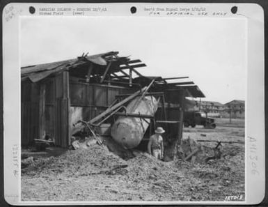 First Army Photos Of The Bombing Of Hawaii, Dec. 7, 1941. Latrine On Coronet Avenue, 11:30 Am. Bomb Damage At Army Airfield. (U.S. Air Force Number 122155AC)