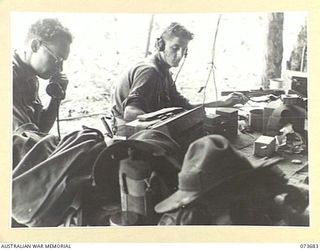 SARANG HARBOUR, NEW GUINEA. 1944-05-31. A SIGNAL RELAY STATION OPERATED BY THE 8TH INFANTRY BRIGADE SIGNAL SECTION. THE LINE RUNS BETWEEN ALEXISHAFEN AND BUNABUN. IDENTIFIED PERSONNEL ARE:- ..