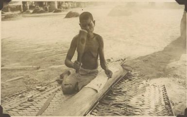 Waseta village woman beats out tapa cloth traditional dress material / Albert Speer