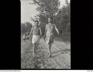 VIVIGANI, GOODENOUGH ISLAND, PAPUA NEW GUINEA. 1943-09-28. SQUADRON LEADER W. T. M. BOULTON OF MANLY, NSW, PILOT (RIGHT) AND FLYING OFFICER A. BURGOYNE, LEEDERVILLE, WA, OBSERVER, BOTH OF NO. 30 ..