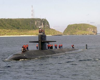 The LOS ANGELES class Attack Submarine USS SALT LAKE CITY (SSN 716) glides past Orote Point as the submarine enters the mouth of Apra Harbor for a short port visit to Guam. The fast attack submarine has one nuclear reactor and measures at 360 feet long. The SALT LAKE CITY is on deployment and homeported out of San Diego, California