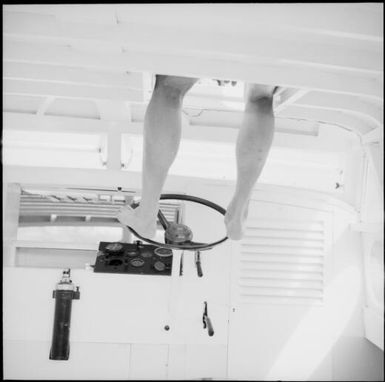 Serge steering a boat with his feet, Fiji, 1966 / Michael Terry