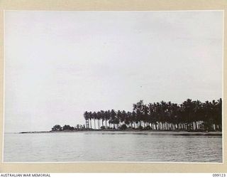 CAPE ENDAIADERE, BUNA-GONA AREA, NEW GUINEA. 1945-10-14. THE CAPE THREE YEARS AFTER THE TIDE OF WAR HAD PASSED THE BUNA-GONA AREA. APART FROM ONE OR TWO LANDING BARGES AND AN OBSERVATION POST TOWER ..