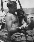 Ship dog "Spencer" and his master Jim Hayden, off Suva, Fiji