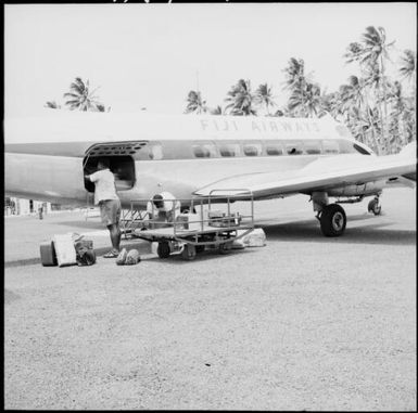 Luggage being loaded on to a Fiji Airways plane, Taveuni, Fiji, 1966 / Michael Terry