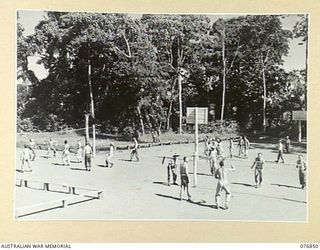 LAE, NEW GUINEA. 1944-11-11. SERGEANT F.J. DUNN, PHYSICAL TRAINING INSTRUCTOR, SUPERVISING REMEDIAL PHYSICAL TRAINING OF CONVALESCENT PATIENTS OF THE 112TH CONVALESCENT DEPOT