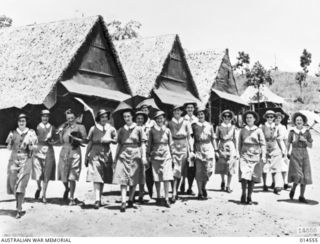 1941-04-01. AUSTRALIAN NURSES IN NEW GUINEA. NURSES LEAVE THEIR MESS HUTS FOR WARDS AT AN AUSTRALIAN GENERAL HOSPITAL IN NEW GUINEA. (NEGATIVE BY N. BROWN)