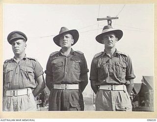 CAPE WOM, WEWAK AREA, NEW GUINEA. 1945-09-05. LIEUTENANT G.D. MCLEAN, ARTY OC (1), CAPTAIN J.F. MCWILLIAM (2) AND LIEUTENANT J.F.L. LAVER, DUTY OFFICER (3), OFFICERS OF 6 DIVISION PROVOST COMPANY