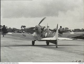 KIRIWINA, TROBRIAND ISLANDS, PAPUA. 1944-01-11. THE WEATHER IS HOT WHERE THE SPITFIRE AIRCRAFT OF NO. 79 (SPITFIRE) SQUADRON RAAF ARE OPERATING IN THE NEW GUINEA AREA AND GROUND CREWS SAVE ENERGY ..