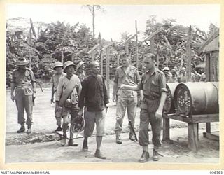 TOROKINA, BOUGAINVILLE. 1945-09-14. SOME OF THE MEMBERS OF A PARTY OF 79 CHINESE AT TOROKINA COMPOUND. FORMER PRISONERS OF THE JAPANESE THEY WERE RELEASED WHEN AUSTRALIAN TROOPS OCCUPIED THE ..