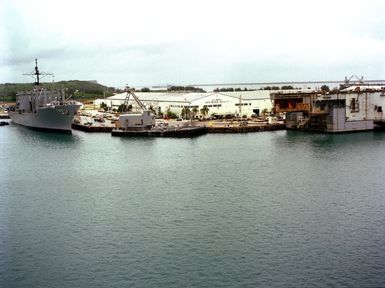 A starboard bow view of the combat stores ship USS NIAGARA FALLS (AFS 3) moored at the US Naval Ship Repair Facility