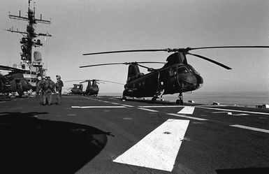 A view of CH-46 Sea Knight helicopters on the flight deck of the amphibious assault ship USS GUAM (LPH 9), during operations off the coast of Beirut, Lebanon