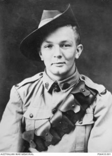 Studio portrait of NX55060 Gunner (Gnr) George Henry Thornton, 17 Anti-Tank Battery, Royal Australian Artillery, of Gladesville, NSW.  Gnr Thornton enlisted June 1940 and served in New Britain.  ..