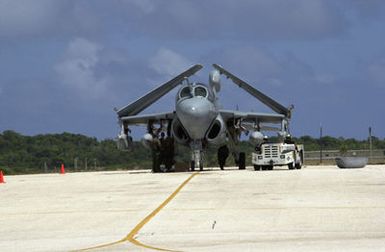 Aircrews work on an EA6B Prowler assigned to the Marine Tactical Electronic Warfare Squadron 2 (VMAQ-2) at Marine Corps Air Station, Iwakuni, Japan, on Andersen Air Force Base (AFB), Guam, in support of Exercise COPE NORTH 2002