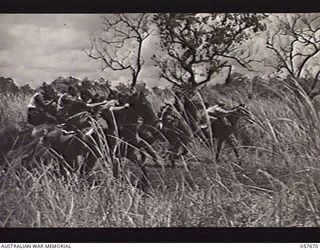 SOPUTA, NEW GUINEA. 1943-10-09. START OF THE FIRST RACE AT A RACE MEETING CONDUCTED BY THE 11TH AUSTRALIAN DIVISION, THE WINNER WAS NO. 7 "SOPUTRID"