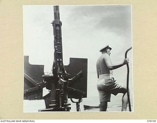 MIOS WUNDI, DUTCH NEW GUINEA. 1944-11-15. THE OFFICER OF THE WATCH ABOARD THE ROYAL AUSTRALIAN NAVY VESSEL HMAS KIAMA