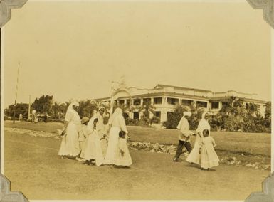 Indian family in front of the Grand Pacific Hotel, Suva, 1928