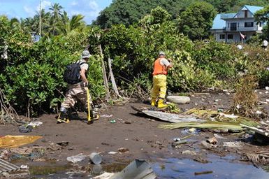 Earthquake ^ Tsunami - Leone, American Samoa, October 2, 2009 -- Members the Hawaii National Guard, Civil Support Team, search for hazardous waste. The collection of hazardous waste is an important step in the removal of debris after a tsunami disaster.