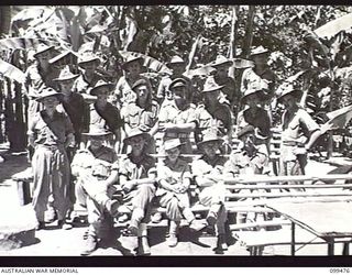 RABAUL, NEW BRITAIN, 1945-12-19. GROUP OF AUSTRALIAN ARMY EDUCATION SERVICE INSTRUCTORS OF NONGA EDUCATION CENTRE, DIVISION TROOPS