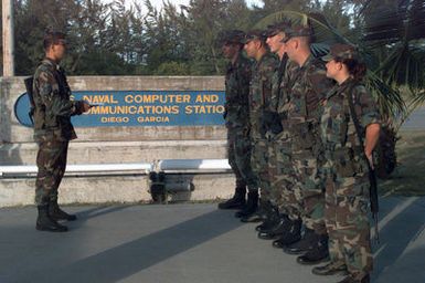 STAFF Sergeant Michael J. Sherbourne, Element Leader, 15th Security Forces Squadron, Hickam Air Force Base, Hawaii, gives a briefing to flight line security personnel deployed to Navy Support Facility (NFS) Diego Garcia to as part of the Second Air Expeditionary Group prior to a shift change. The Second Air Expeditionary Group is in support of Operation SOUTHERN WATCH. SOUTHERN WATCH involves patrolling the no-fly zone in southern Iraq